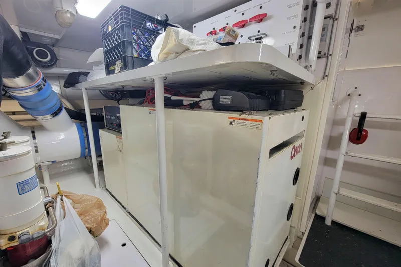 Slide: The Image of Engine room of 2002 Viking 65 Enclosed Bridge yacht with Onan generator. - 90