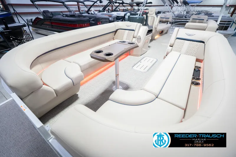 Slide: The Image of Luxurious interior of 2026 Bennington 26 MSL pontoon boat with plush seating and ambient lighting. - 12