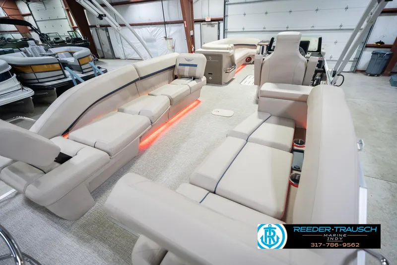 Slide: The Image of Luxurious interior of 2026 Bennington 26 MSL pontoon boat with plush seating and ambient lighting. - 14