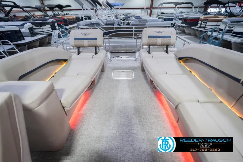 Slide: The Image of Interior view of 2026 Bennington 26 MSL pontoon boat with luxurious seating and ambient lighting. - 18