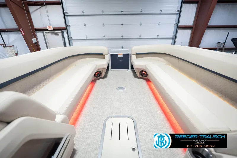 Slide: The Image of Luxurious interior of 2026 Bennington 26 MSL boat with ambient lighting and plush seating. - 22