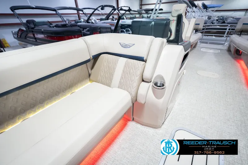 Slide: The Image of Luxurious interior of 2026 Bennington 26 MSL pontoon boat with elegant seating and ambient lighting. - 24