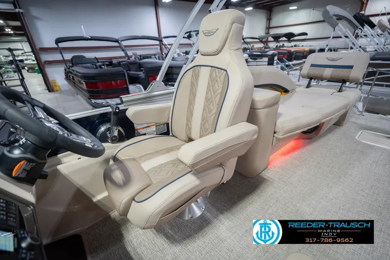 Slide: The Image of Luxurious interior of 2026 Bennington 26 MSL pontoon boat with plush seating. - 30