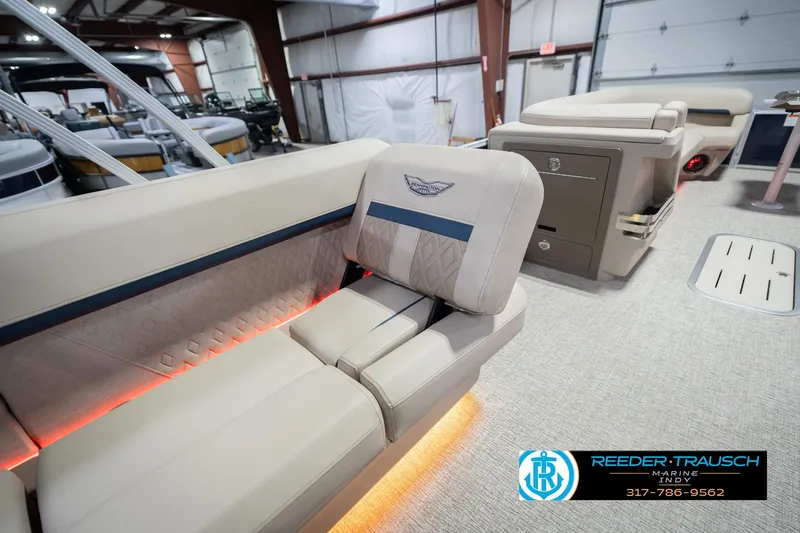 Slide: The Image of Luxurious interior of 2026 Bennington 26 MSL pontoon boat with elegant seating and ambient lighting. - 31