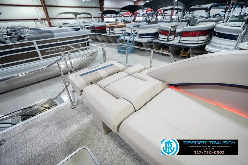 Slide: The Image of 2026 Bennington 26 MSL pontoon boat interior in showroom with luxury seating. - 36