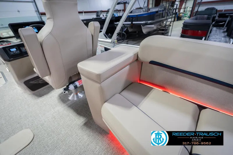 Slide: The Image of Luxurious interior of 2026 Bennington 26 MSL boat with beige seating and ambient lighting. - 37