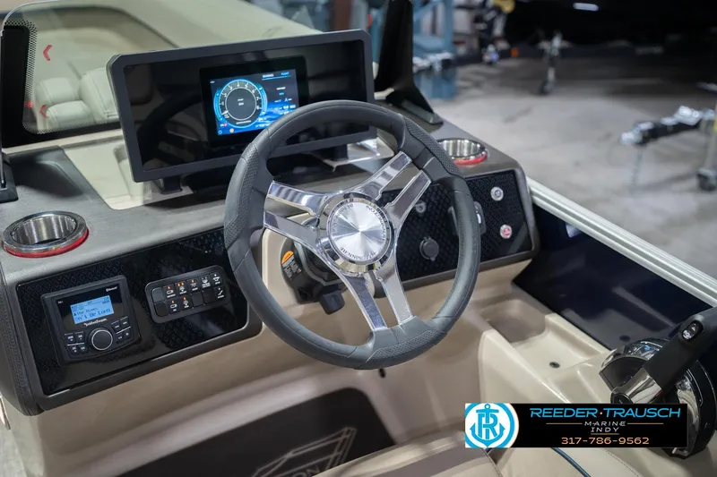 Slide: The Image of 2026 Bennington 26 MSL boat dashboard with steering wheel and digital display. - 40