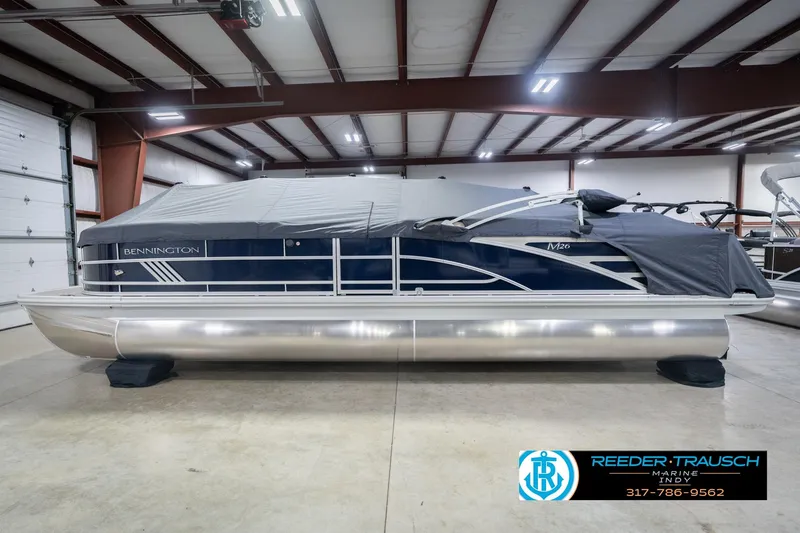 Slide: The Image of 2026 Bennington 26 MSL pontoon boat in indoor storage, covered and secured. - 59