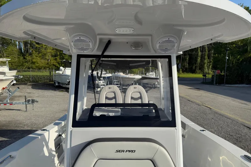 Slide: The Image of 2025 Sea Pro 262 Offshore boat interior with modern helm and seating. - 13