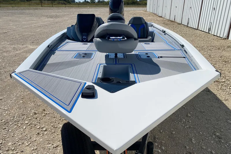 Slide: The Image of 2026 G3 Sportsman 1710SE boat, sleek design, spacious deck, modern seating, outdoor setting. - 2