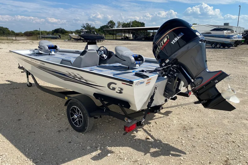 Slide: The Image of 2026 G3 Sportsman 1710SE boat with Yamaha engine on a trailer, outdoors. - 4