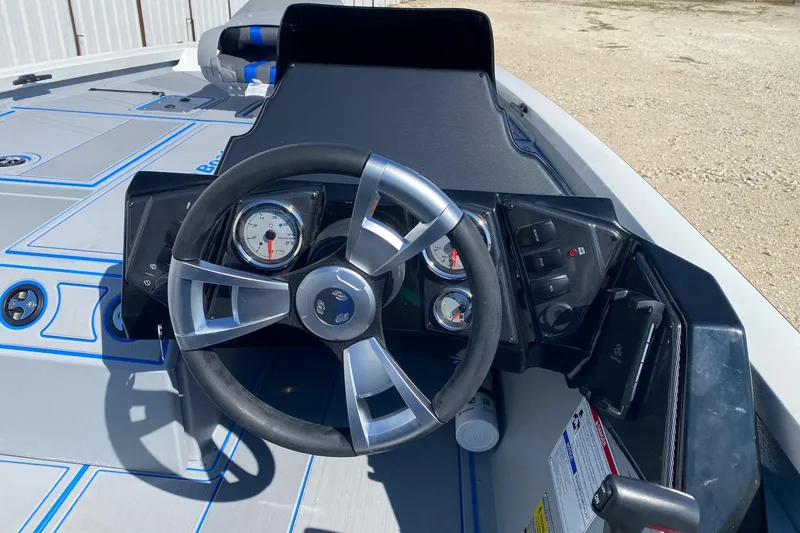 Slide: The Image of 2026 G3 Sportsman 1710SE boat dashboard with steering wheel and gauges. - 8