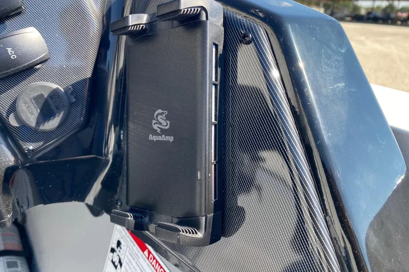 Slide: The Image of Close-up of AquaAmp device on 2026 G3 Sportsman 1710SE dashboard. - 9