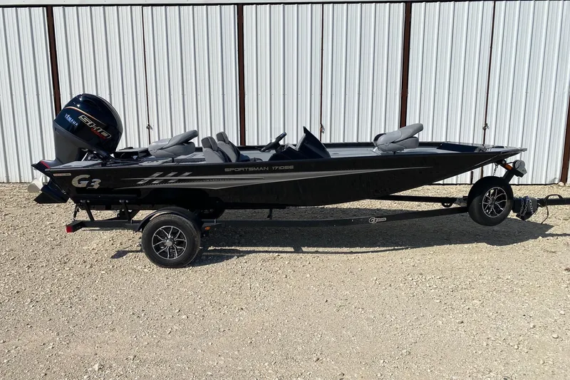 The Image of 2026 G3 Sportsman 1710SE boat on trailer, parked outdoors, side view. - 0