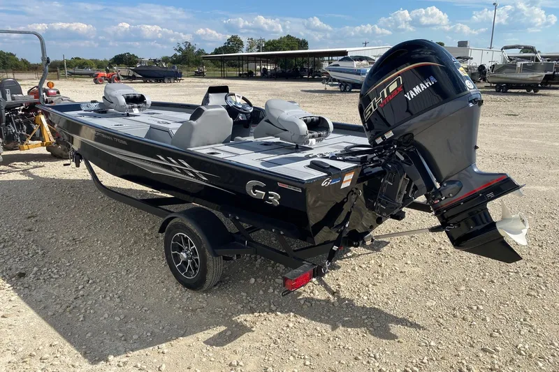 Slide: The Image of 2026 G3 Sportsman 1710SE boat with Yamaha engine on a trailer, parked outdoors. - 4