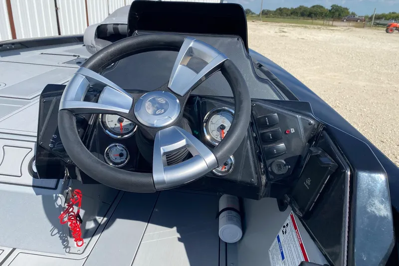 Slide: The Image of 2026 G3 Sportsman 1710SE boat dashboard with steering wheel and gauges. - 6