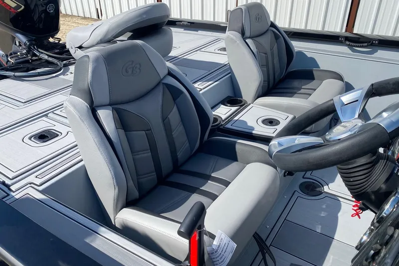 Slide: The Image of 2026 G3 Sportsman 1710SE boat interior with gray seats and steering wheel. - 7