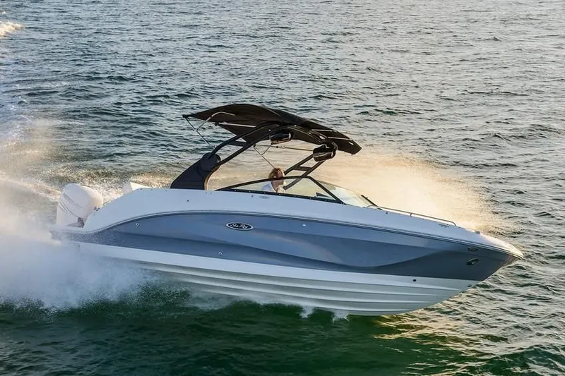 Slide: The Image of 2019 Sea Ray SDX 250 Outboard boat cruising on water. - 52