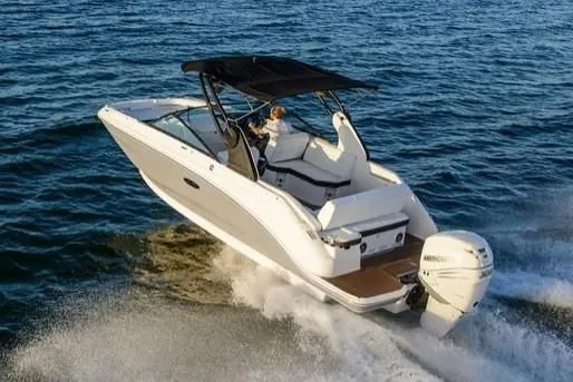 Slide: The Image of 2019 Sea Ray SDX 250 Outboard boat cruising on water. - 54