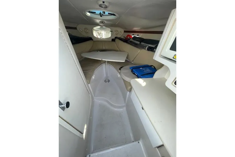Slide: The Image of Interior of 2001 Four Winns 285 Sundowner boat with seating and table. - 2