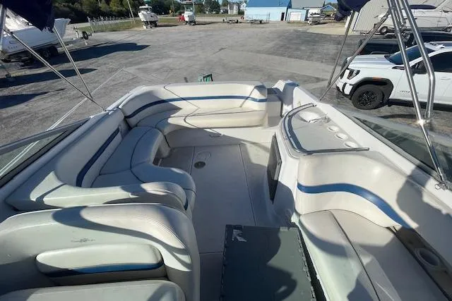 Slide: The Image of 2001 Four Winns 285 Sundowner boat interior with spacious seating and sleek design. - 5