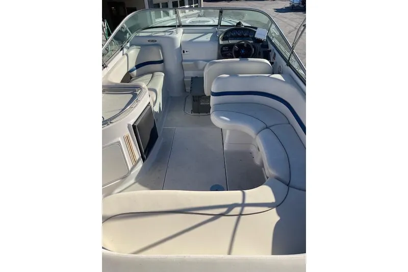 Slide: The Image of 2001 Four Winns 285 Sundowner boat interior with white seating and steering console. - 7