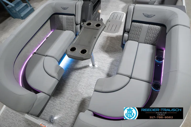 Slide: The Image of Luxurious interior of 2026 Bennington 22 MFB pontoon boat with LED lighting and plush seating. - 12