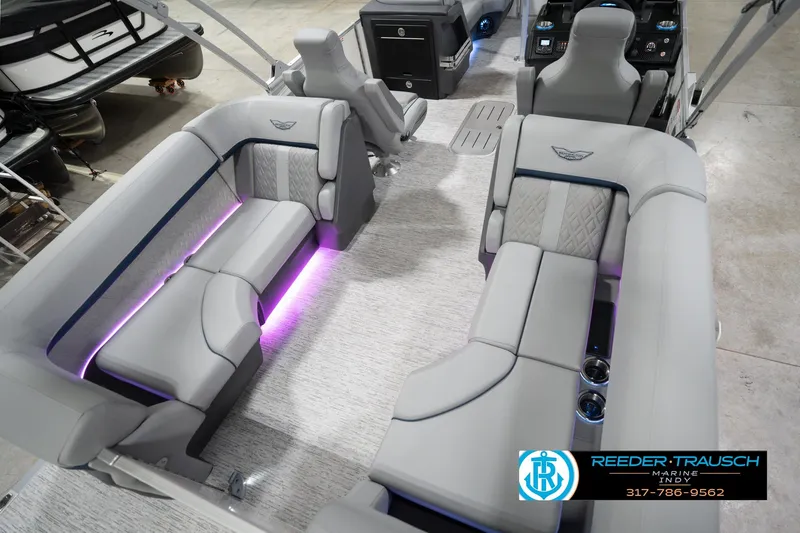 Slide: The Image of 2026 Bennington 22 MFB boat interior with luxurious seating and ambient lighting. - 14