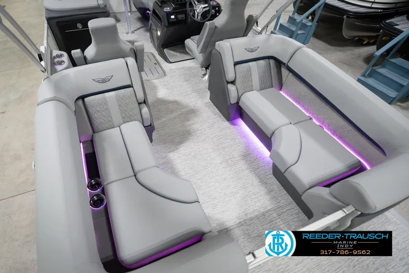 Slide: The Image of 2026 Bennington 22 MFB boat interior with luxurious seating and ambient purple lighting. - 15