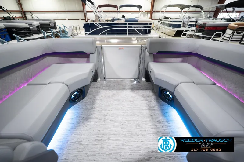 Slide: The Image of 2026 Bennington 22 MFB pontoon boat interior with modern seating and ambient lighting. - 18