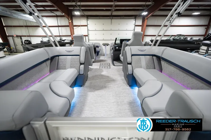 Slide: The Image of Luxurious interior of 2026 Bennington 22 MFB pontoon boat with plush seating and ambient lighting. - 19