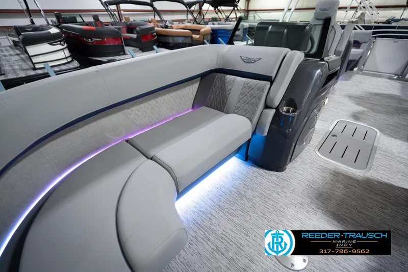 Slide: The Image of Luxurious interior of 2026 Bennington 22 MFB pontoon boat with elegant seating and ambient lighting. - 23