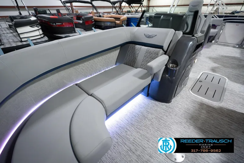 Slide: The Image of 2026 Bennington 22 MFB boat interior with luxurious seating and ambient lighting. - 24