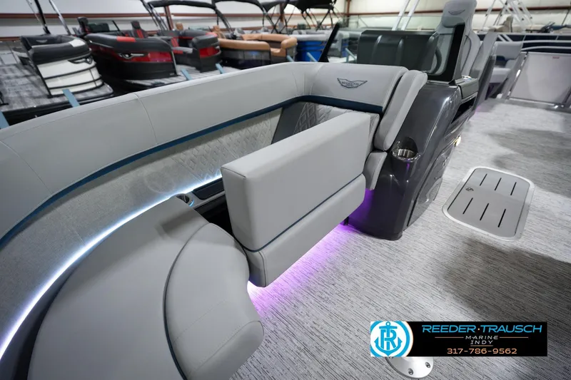 Slide: The Image of 2026 Bennington 22 MFB boat interior with modern seating and ambient lighting. - 25