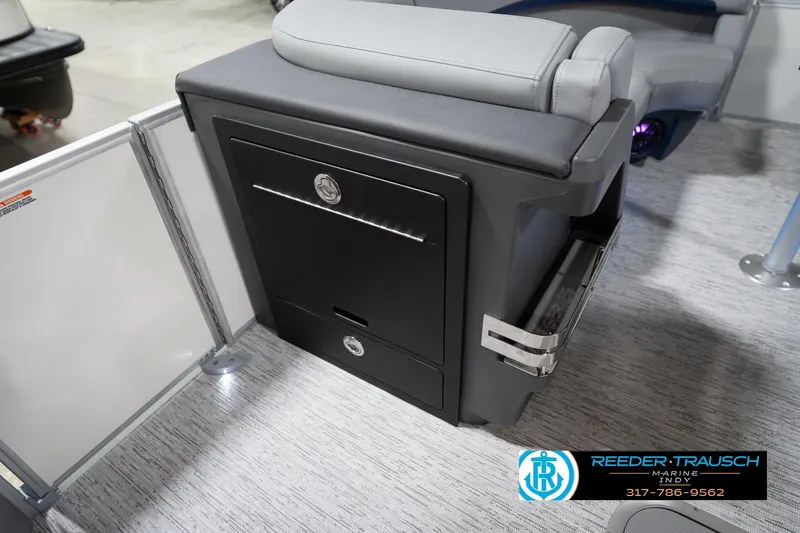 Slide: The Image of 2026 Bennington 22 MFB boat interior with storage compartment and seating. - 28