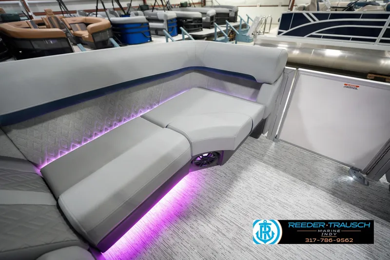 Slide: The Image of Luxurious seating on 2026 Bennington 22 MFB pontoon boat with ambient purple lighting. - 33