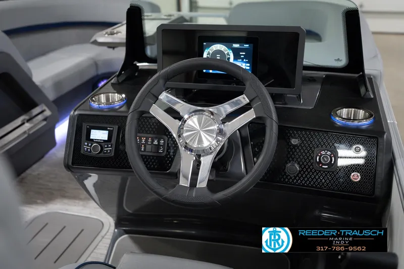 Slide: The Image of 2026 Bennington 22 MFB boat dashboard with modern steering wheel and digital display. - 35