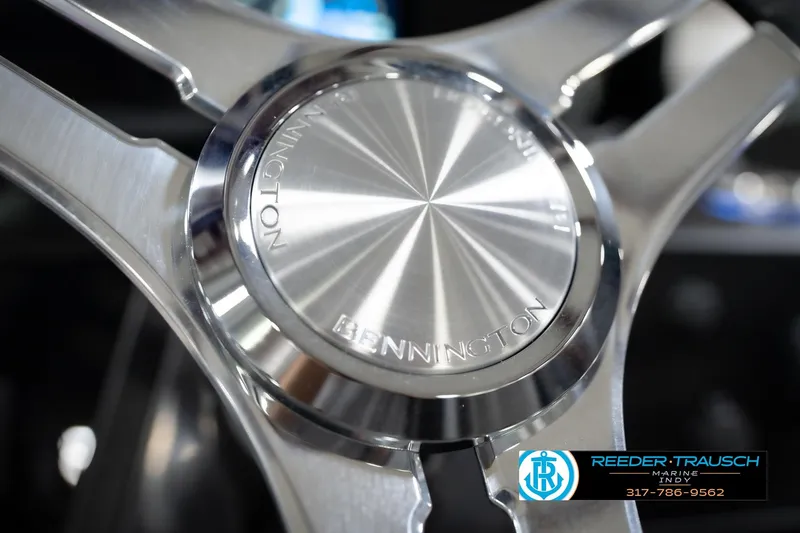 Slide: The Image of Close-up of 2026 Bennington 22 MFB steering wheel with Reeder-Trausch Marine logo. - 37