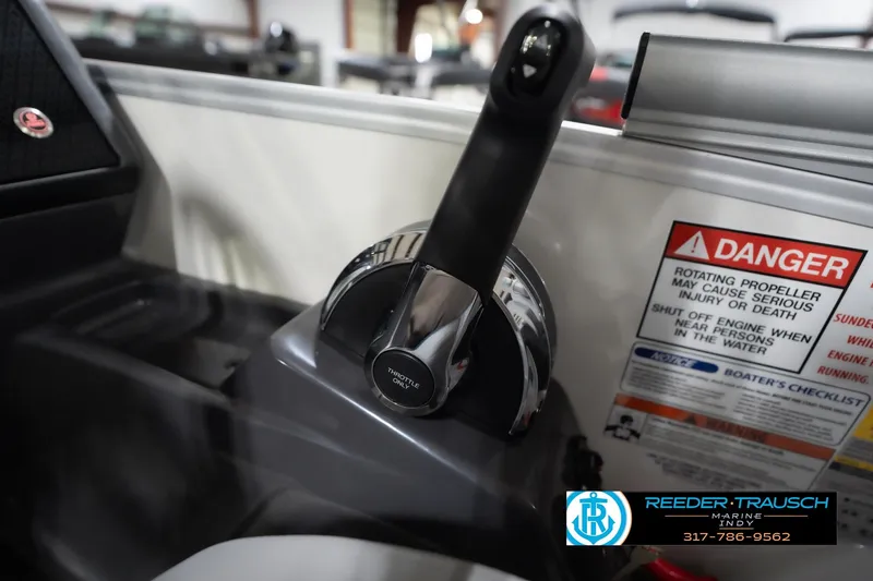 Slide: The Image of Throttle control of 2026 Bennington 22 MFB boat with safety warning label. - 42