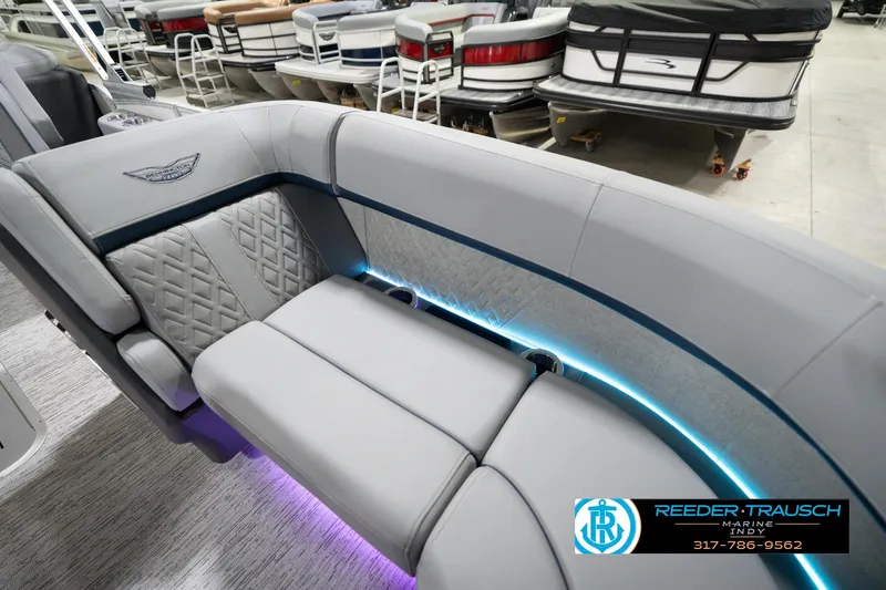 Slide: The Image of 2026 Bennington 22 MFB boat interior with luxurious seating and ambient lighting. - 46
