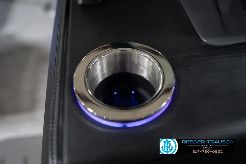 Slide: The Image of Illuminated cup holder on 2026 Bennington 22 MFB boat, featuring sleek design and blue lighting. - 49