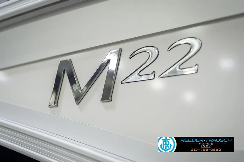 Slide: The Image of 2026 Bennington 22 MFB boat emblem with Reeder-Trausch Marine logo. - 53