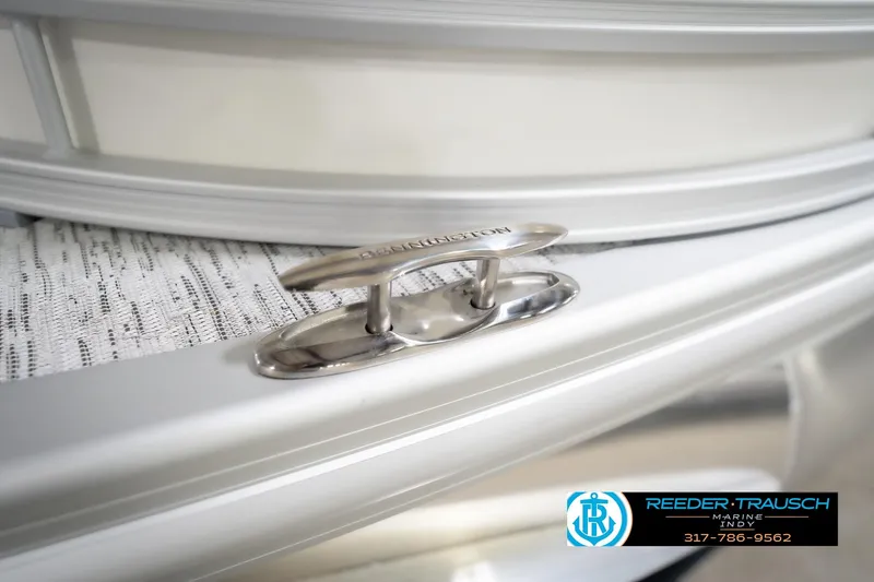 Slide: The Image of 2026 Bennington 22 MFB boat cleat detail with Reeder-Trausch Marine logo. - 64