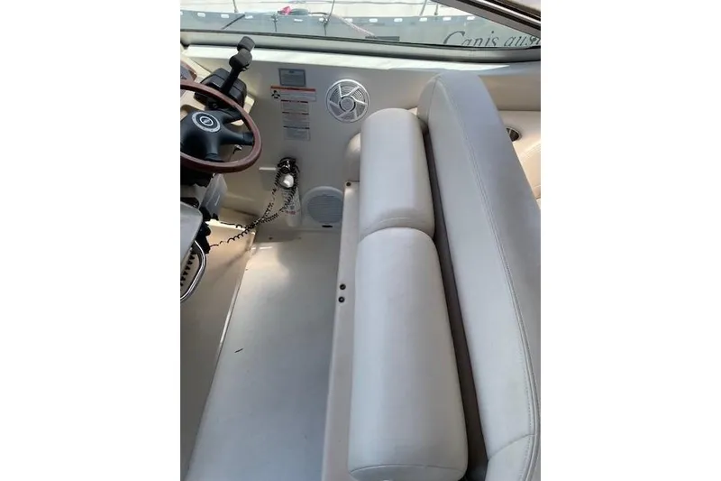 Slide: The Image of 2007 Chaparral 330 Signature boat interior with steering wheel and seating area. - 10