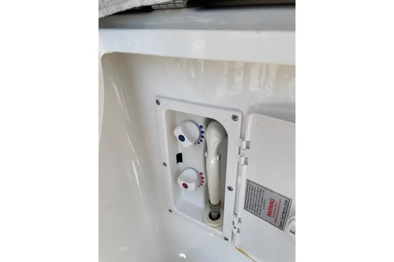 Slide: The Image of 2007 Chaparral 330 Signature boat shower controls with temperature dials. - 12