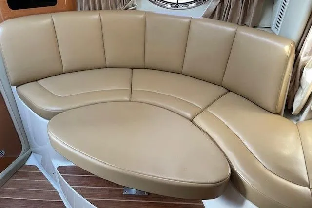 Slide: The Image of 2007 Chaparral 330 Signature boat interior with tan leather seating and wood flooring. - 14