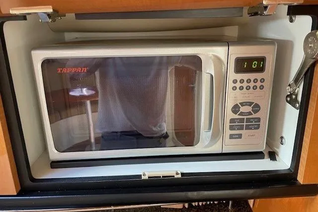 Slide: The Image of Tappan microwave inside 2007 Chaparral 330 Signature boat kitchen cabinet. - 17