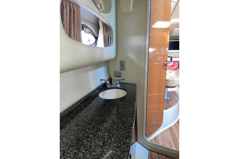 Slide: The Image of 2007 Chaparral 330 Signature yacht interior with granite countertop and sink. - 26