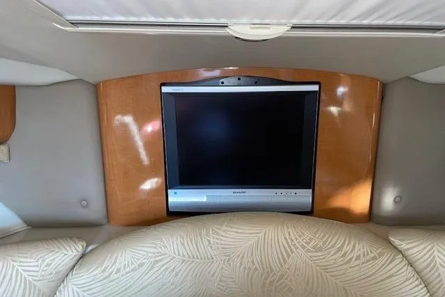 Slide: The Image of 2007 Chaparral 330 Signature cabin with TV and comfortable seating. - 28