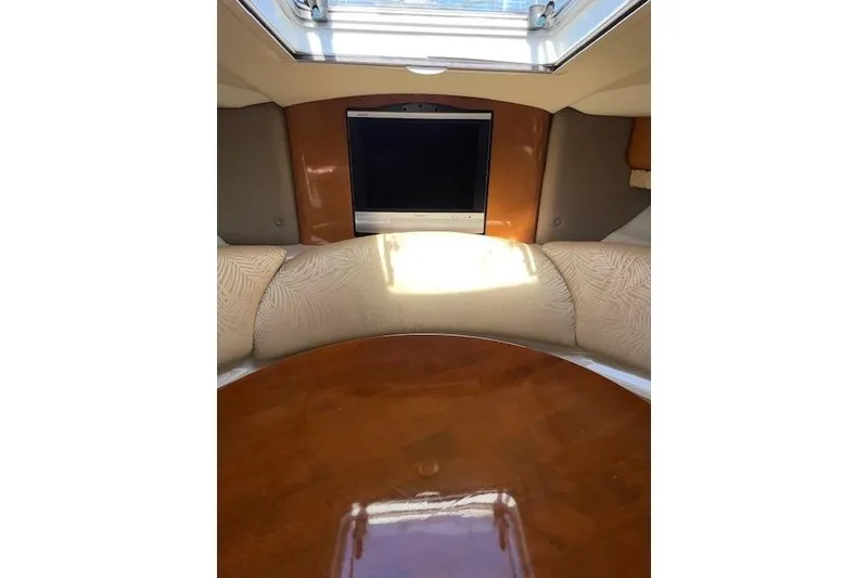 Slide: The Image of 2007 Chaparral 330 Signature yacht interior with TV and plush seating. - 29